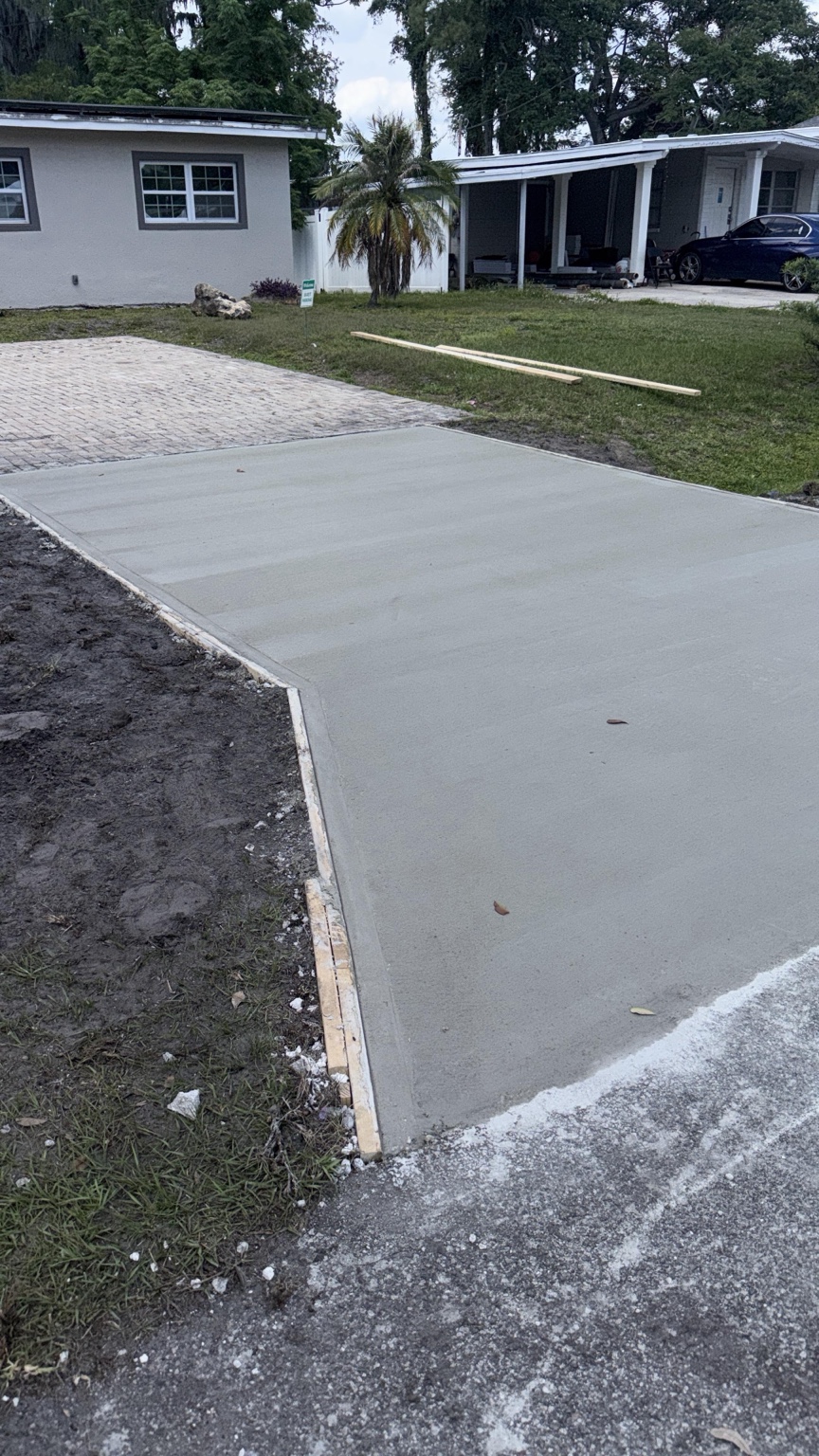 Completed concrete driveway by Brothers Rodriguez LLC